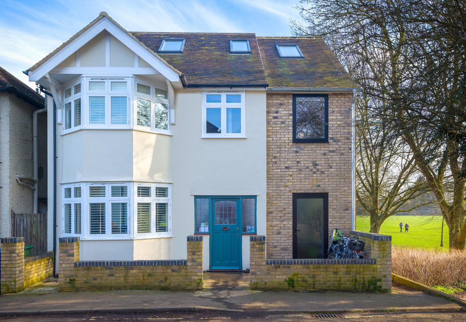 buff brick side extension black aluminum framed window and glazed door